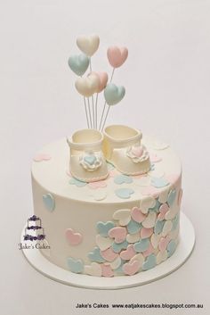 there is a cake with balloons on it