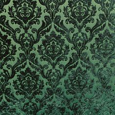 green and black damask wallpaper with ornate design on the bottom half of it