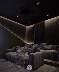 a large couch sitting in the middle of a living room next to a stair case