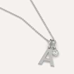 A personalized initial necklace pendant design featuring a letter A charm. This beautiful women's letter necklace is approx. 1cm tall and comes in solid 14k white or yellow gold with an optional 0.05 carat (3mm) diamond and an adjustable 16 inch - 18 inch chain. For all other letters, check out our initial necklace collection. Minimalist Monogram Initial Necklace In White Gold, Silver Pendant Initial Necklace In Fine Jewelry, Classic White Gold Monogram Initial Necklace, Minimalist White Gold Monogram Initial Necklace, Everyday White Gold Initial Pendant Necklace, Classic Monogram Sterling Silver Charm Necklace, Classic Sterling Silver Monogram Charm Necklace, Silver Diamond Initial Pendant Necklace, Silver Sterling Silver Initial Necklace