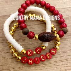 This is an awesome stackable set with strands that have a football accent center, KC lettering and Chiefs lettering. stunning red beads! So comfy Football Friendship Bracelet, Polymer Clay Bracelet Ideas, Football Friendship, Clay Bracelet Ideas, Kansas City Chiefs Craft, Chiefs Crafts, Football Bracelet, Kansas City Football, Bracelet Inspo