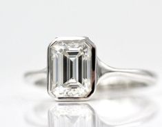 Moissanite Ring, 925 Sterling Silver Ring, Emerald cut Ring, Solitaire Ring, Engagement Ring, Wedding Ring, Gift for her, 100% Good Quality, Stone    :- Moissanite Size       :- 8×6 MM  Shape    :- Emerald cut Material  :-  925 Sterling silver ❁❁ 𝐉𝐞𝐰𝐞𝐥𝐫𝐲 𝐂𝐞𝐫𝐭𝐢𝐟𝐢𝐜𝐚𝐭𝐞 ❁❁ ↣ KHJewels branded authenticate Jewellery Certificate comes with the authenticity of Metal, Moissanite, and Gemstone combination. ↣ The certificate comes with Limited Lifetime Warranty details. ↣ Listed Jewellery Radiant Cut Emerald Ring In Sterling Silver For Wedding, Vs Clarity Emerald-cut Sterling Silver Crystal Ring, Sterling Silver Solitaire Wedding Ring Emerald Cut, White Emerald Cut Sterling Silver Wedding Ring, White Emerald-cut Rings With Bezel Setting, Sterling Silver Rings With Bezel Setting And Emerald Cut, Sterling Silver Emerald-cut Diamond Ring For Wedding, Sterling Silver Solitaire Diamond Ring, Baguette Cut, Emerald Cut Crystal Solitaire Ring For Formal Occasions