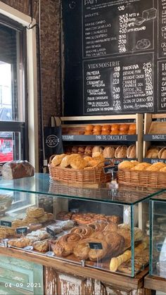 a bakery filled with lots of different types of bread