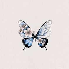 a blue butterfly with white and pink flowers on it's wings, flying in the air