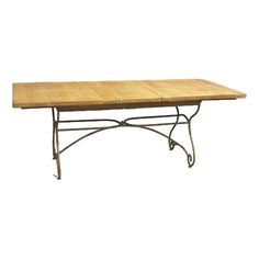 a wooden table sitting on top of a metal frame