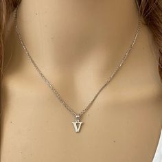 Description: 925 Sterling Silver Mini Small Initial Letter V Pendant Necklace Item No.: H89.Q Metal Type: 925 Sterling Silver (Available In 10k And 14k Gold) Metal Color: Silver Height With Bale: 15 Mm Width: 4.8 Mm Italian Rolo Chain In 16", 18", 20", 22" Available In Another Listings In Any Letter A-Z Made To Order. Please Allow 10-15 Days To Be Shipped. V Pendant Necklace, V Initial Necklace, Doctor Lifestyle, Letter V Necklace, Random Jewelry, V Pendant, V Necklace, Initial Necklace Silver, Cross Necklace Sideways