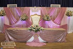 a banquet table with pink and gold decor