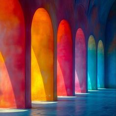 an image of the inside of a building that is painted in rainbow colors with columns and arches