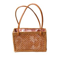 Rattan Top Handle Shoulder tote is the perfect addition to your bag collection. Features a fully lined drawstring closure batik print 100% cotton lining. Perfect to carry your keys, wallet, phone and other essentials. (PRODUCT INFO): Material: Rattan/Ata Size: 6" H x 9" L x 4" D inches Fully lined interior-100% cotton batik print Drawstring closure (SHIPPING INFO): All our items are made-to-order, therefore please allow 3-5 business days for production. Our goal is to become more sustainable throughout our production process, reducing overproduction and maintaining responsible stock levels. Thank you for your patience in supporting our mission. Thank you for choosing to support sustainable shopping! We value your support. Traditional Everyday Rectangular Bag, Traditional Rectangular Everyday Bag, Square Shoulder Bag With Bamboo Handle For Travel, Brown Travel Bags With Bamboo Handle, Rectangular Light Brown Beach Bag For Travel, Brown Straw Bag With Mobile Phone Pocket For Travel, Square Brown Beach Bag With Leather Handles, Brown Square Beach Bag With Leather Handles, Brown Straw Travel Bag With Mobile Phone Pocket