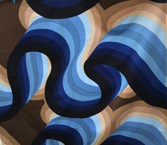 an abstract painting with blue and brown waves in the center, on a black background