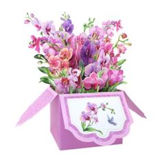 a pink box filled with lots of purple flowers