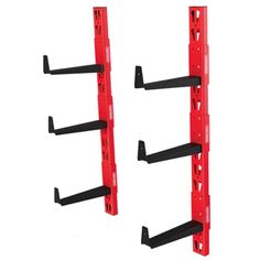 two red racks with black straps on each side and one is attached to the wall