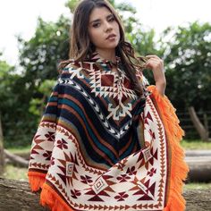 Celebrate this holiday season with a truly meaningful gift—introduce your loved ones to the QISU Inca Essence Poncho, a cozy and authentic piece inspired by the timeless heritage of the Andes. Handcrafted with care in Ecuador, it blends 60% wool and 40% acrylic for breathable warmth and softness, making it ideal for festive gatherings, snug evenings by the fire, or strolling through Christmas markets. Why It’s the Perfect Holiday Present: Festive Warmth & Comfort: Keep loved ones wrapped in soft One Size Outdoor Poncho Cape, One Size Poncho Cape For Outdoor, One Size Poncho For Outdoors, Bohemian Multicolor Poncho For Outdoor, Multicolor Bohemian Poncho For Outdoor, Orange Bohemian Shawl For Fall, Bohemian Shawl Cape For Fall, Bohemian Cape With Shawl Scarf, One Size Fringe Shawl Cape