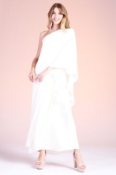 Gear up for your formal events with this angelic Soft Athena One Shoulder Maxi. This piece is made with our soft and beautiful poly silk, leaving you feeling luxurious and comfortable. The one shoulder is timeless and falls to the wrists, keeping you covered and ready for any weather climate that comes your way. One shoulder neckline Maxi length Draped sleeve Soft satin-like finish Self: 100% Poly | Lining: 100% Poly Made in USA SKU #: D-7756 Satin One Shoulder Dress For Spring Wedding, Satin One-shoulder Dress For Spring Weddings, Elegant Silk One Shoulder Wedding Dress, Spring Wedding Silk One Shoulder Dress, Pre-draped Silk One Shoulder Dress For Wedding, Pre-draped Silk One-shoulder Dress For Wedding, Pre-draped Silk One-shoulder Wedding Dress, Elegant Draped One-shoulder Wedding Dress, Silk Off-shoulder Wedding Gown