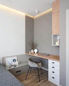 a bedroom with a bed, desk and shelves on the wall next to each other