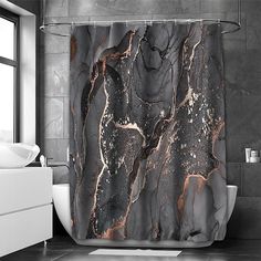 a black and white marble shower curtain in a bathroom