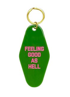 a green keychain with the words feeling good as hell on it's side