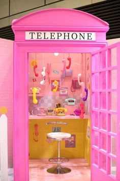 there is a pink phone booth in the store