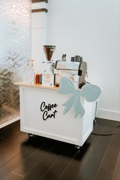 the coffee cart is decorated with bows on it's front and back sides, along with other items