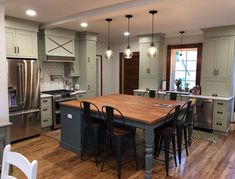 a large kitchen with an island in the middle