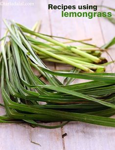 some green grass sitting on top of a wooden table with the words recipes using lemongrasss