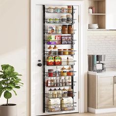 a pantry door is open to reveal an organized pantry and food storage area in the kitchen