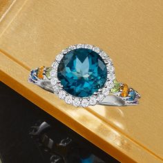 Ross-Simons - 4.20ct London Blue Topaz, 1.00ct t. w. Multi-Gemstone Ring Size 10. A sparkling rainbow awaits in this outstanding take on the traditional halo ring. A radiant 4.20 carat London blue topaz centerpiece is framed by .50 ct. t. w. white topaz atop a sterling silver band lined with .50 ct. t. w. amethyst, citrine, peridot, and London blue topaz gems. 1/2" wide. Multi-gemstone and London blue topaz ring. Peridot birthstones are the perfect gift for August birthdays. August Birthdays, Peridot Birthstone, Multi Gemstone Ring, London Blue Topaz Ring, Size 10 Rings, London Blue Topaz, Blue Topaz Ring, Halo Ring, Halo Rings