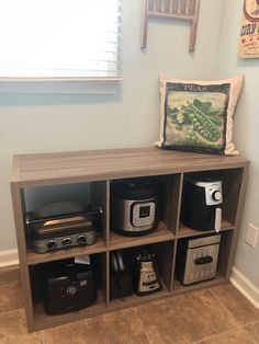 a shelf with various kitchen items on it