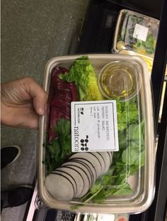 a plastic container filled with different types of vegetables