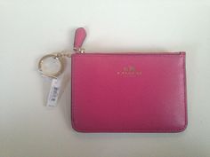 NEW Coach Wallet with Key Chain!!! Brand New with original tags attached!!!!  Pink leather!!  Gold zipper and Key chain.  3.5" tall and 5" wide. Pink fabric lining.  Please check out my store for More Coach Scarves, Wallets and Backpacks! Returns accepted within 30 days unused items with tags attached.                          Buyer Pays Return shipping, Original shipping not refunded. Luxury Coach Wallet On Chain Rectangular, Luxury Pink Wallet On Chain For Everyday Use, Pink Coach Wallet For Travel, Pink Wallet Coach, Coach Pink Wallet With Removable Pouch, Coach Scarf, Coach Wallet With Zipper Closure For On-the-go, Coach Wallet, Coach Leather