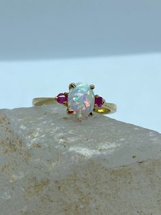 Opal Engagement Ring - Opal Gold Ring - 14k Gold Opal Ring - White Opal Ring - Opal Ruby Ring - Opal Gold Rings - Gemstone Engagement Ring *14k solid gold *solid gold (NOT plated) *gemstone:opal-ruby *opal: 6x8 mm. *opal: 0.45-0.50 ct. *ruby : 2.25 mm. *ruby : 0.11 ct. Three Stone Ruby Ring In 14k Yellow Gold, White Ruby Ring With Center Stone, Oval Multi-stone Yellow Gold Birthstone Ring, 14k Gold Multi-stone Round Gemstones, 14k Gold Opal Promise Ring, White Ruby Ring For Promise, Round Cut, White Ruby Ring In 14k Gold, 14k Gold Opal Ring Fine Jewelry, Fine Jewelry Three Stone Opal Ring