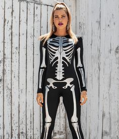 Halloween might not be a traditional time to celebrate the wonders of human anatomy. But this Shimmer Skeleton Costume changes all of that. Featuring each bone highlighted on the front of the costume with shimmering sequins, this comfy bodysuit lets the wearer stroll around the office or at parties with bright shining X-ray quality confidence. Costume Long Sleeve Stretch Bodysuit, Black Long Sleeve Bodysuit For Cosplay, Stretch Long Sleeve Costume Bodysuit, Stretch Long Sleeve Bodysuit For Costume, Halloween Costume Long Sleeve Bodysuit, Long Sleeve Halloween Costume Bodysuit, Halloween Long Sleeve Costume Party Bodysuit, Halloween Long Sleeve Bodysuit For Costume Party, Long Sleeve Bodysuit For Halloween Costume Party