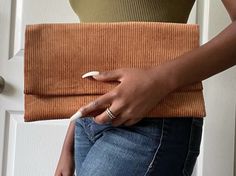 Caramel delight is also a new addition to our fall collection. This corduroy clutch is perfect for those up and coming cold months but also can be worn during the fall seasons. This clutch comes equipped with a bronze magnetic snap to secure items in bag. Size: 13 1/8in x 12in with a 6in pocket Material: corduroy Caramel Delights, Winter Crochet, Fall Handbags, Crochet Handbag, Crochet Purse, Crochet Bags Purses, Shoulder Chain, Fall Accessories, Fall Collection