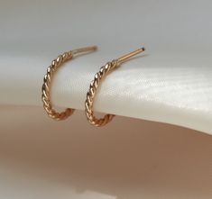 Small hoop earrings for the minimalist. Handmade just for you in my Vermont studio.  Measurements & More Details:         Size: ½”       Available in 14k gold filled and sterling silver.  Sold per pair.       This item is made to order.      What is gold filled? 14K gold-filled means that multiple layers of solid, 14k gold have been securely pressure bonded to a core of high quality jeweler’s brass.  The US strictly regulates this industry standard, requiring 1/20th, or 5%, gold by weight in Cleaning Silver, Bridal Jewelery, Dainty Gold Jewelry, Burlington Vermont, How To Clean Silver, Handmade Gold Jewellery, Cleaning Silver Jewelry, Gold Bond, Small Hoop Earrings