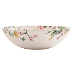 a white bowl with flowers on it