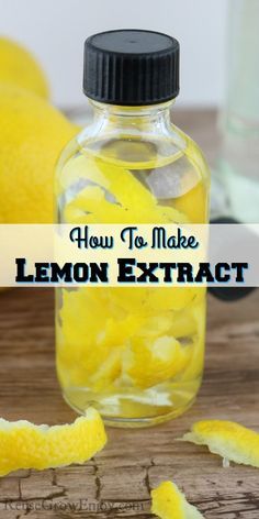 a glass bottle filled with lemons sitting on top of a wooden table next to sliced lemon