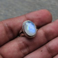 Gemstone - Natural Rainbow Moonstone Gemstone Size - 1x14 mm oval  Metal - Sterling Silver natural AAA rainbow moonstone set with a sterling silver handmade ring  Each Ring made with Precision and love, these rings are perfect for everyday use and a perfect accessory to wear at work.  Rings can be customized on request and gemstone can be switched to any other as per requirement.  Other beautiful designs uploaded with fabulous gemstones. kindly visit my store to view the complete collection.  Feel free to contact me for any queries regarding jewelry or for bulk order.  The ring will be gift wrapped in a premium handmade jewelry box Oval Cabochon Moonstone Jewelry, Bohemian Moonstone Cabochon Jewelry, Silver Celestial Oval Jewelry, Celestial Oval Gemstone Jewelry, Bohemian Oval Cabochon Moonstone Ring, Mystical Round Cabochon Jewelry, Mystical Adjustable Oval Jewelry, Adjustable Oval Mystical Jewelry, White Oval Celestial Rings