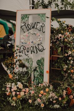 a sign that says flower crowns surrounded by flowers