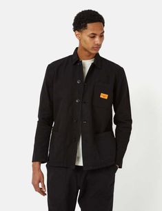 Get your hands on this service works canvas coverall jacket in black - the ultimate workwear essential! made with 100% organic 360gsm (11oz) cotton canvas this classic jacket boasts convenient patch pockets a tonal button placket and an open collar.    to top it off it's adorned with service works' signature label branding. go ahead snag one for yourself!    product details —    — material: gots organic 360gsm (11oz) cotton canvas  — 3 pocket construction  — 5 button closure  — service works woven label branding    washcare —    — wash at 30 degrees with similar colours  — hang to dry Black Cotton Outerwear With Patch Pockets, Black Cotton Utility Jacket For Everyday, Everyday Black Cotton Utility Jacket, Black Cotton Utility Outerwear, Classic Black Utility Jacket For Everyday, Urban Cotton Outerwear For Work, Black Cotton Utility Jacket With Button Closure, Classic Cotton Utility Jacket With Double-needle Stitching, Black Everyday Utility Jacket