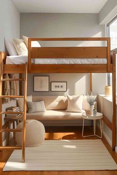 a living room with a couch and bunk bed in it, next to a window