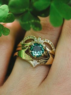 a close up of a person's hand with a ring on top of it