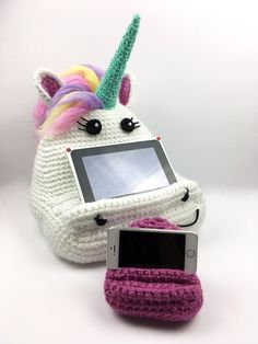 a phone case with a unicorn on it and a cellphone in the other hand