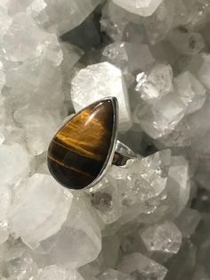 Tiger's Eye Ring – Tropica Exotica, LLC Teardrop Stackable Adjustable Rings, Sterling Silver Rings With Brown Natural Stones, Brown Sterling Silver Rings With Natural Stones, Handmade Adjustable Teardrop Rings, Adjustable Brown Sterling Silver Ring, Unique Teardrop Promise Ring, Spiritual Teardrop Gemstone Rings, Brown Large Stone Ring Jewelry, Brown Gemstone Sterling Silver Rings