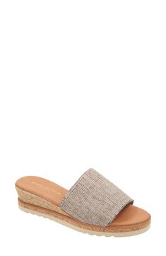 A cork-covered midsole and jute-wrapped wedge lend visual intrigue to an espadrille-inspired slide sandal set on a cushioned footbed for all-day comfort. 1 3/4" heel; 1/2" platform Cushioned footbed Textile upper/leather lining/synthetic sole Made in Spain Slip-on Platform Wedge Espadrille Sandals, Beach Straw Wedge Sandals With Cork-bed Midsoles, Platform Straw Slip-on Espadrilles, Beach Mules With Cushioned Footbed And Wedge Heel, Cushioned Wedge Heel Mules For The Beach, Beach Wedge Heel Mules With Cushioned Footbed, Vacation Espadrille Wedge Sandals With Textured Sole, Beige Wedge Espadrilles With Textured Sole, Vacation Wedge Sandals With Textured Sole