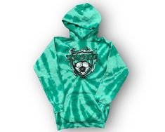 Our Zionsville soccer art comes in our super soft beach wash hoodie. Fit: The youth hoodie runs true to size. Fabrication: 52/40 Cotton/ Poly Casual Hoodie For Football Season, Green Casual Hoodie For Fan Merchandise, Casual Green Hoodie For Fan Merchandise, Casual Hooded Sweatshirt For Football Season, Green Casual Hoodie For Sports Events, Casual Green Hoodie For Sports Events, Green Casual Pre-shrunk Hoodie, Casual Green Pre-shrunk Hoodie, Tye Dye Hoodie