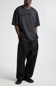 A voluminous pleated silhouette inspired by skating culture enhances the easygoing style of these baggy-fit chinos topped with an elastic waist. Elastic waist Side-seam pockets; back patch pocket 100% cotton Dry clean Made in Italy Designer Clothing Mens Cropped Black Pants, Loose Fit Pants With Cost Men, Mens Streetwear Shirts, Formal Street Wear Men, Clean Style Outfit Men, Baggy Black Pants Outfit, Boy Style Summer, Oversized Tshirt Aesthetic, Guy Street Style