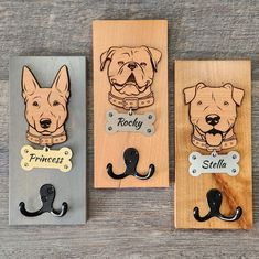 three wooden magnets with dogs on them