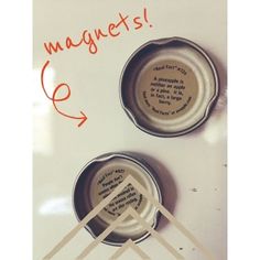 two cans with magnets attached to the lids