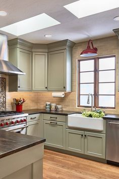 a kitchen with an oven, sink and dishwasher