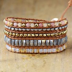 This exquisite wrap bracelet is crafted with luxurious labradorite, jasper, crystal, and pyrite stones and is sure to give your look a touch of bohemian chic. The stackable design creates a layered effect that adds texture and an eye-catching shimmer for a stunning, sophisticated accessory that will bring a hint of glamour to any ensemble. *Material: Jasper, labradorite, crystal, pyrite, leather *Making Technics: Handmade Sewed *Size: 32.5 inches, 3 closures adjust length to fit your wrist. *Pro Crystal Pyrite, Gemstone Wrap Bracelet, Leather Making, Labradorite Crystal, Bohemian Chic, Natural Materials, Wrap Bracelet, Hand Woven, Labradorite